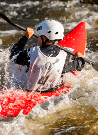 Slalom paddler in rapids